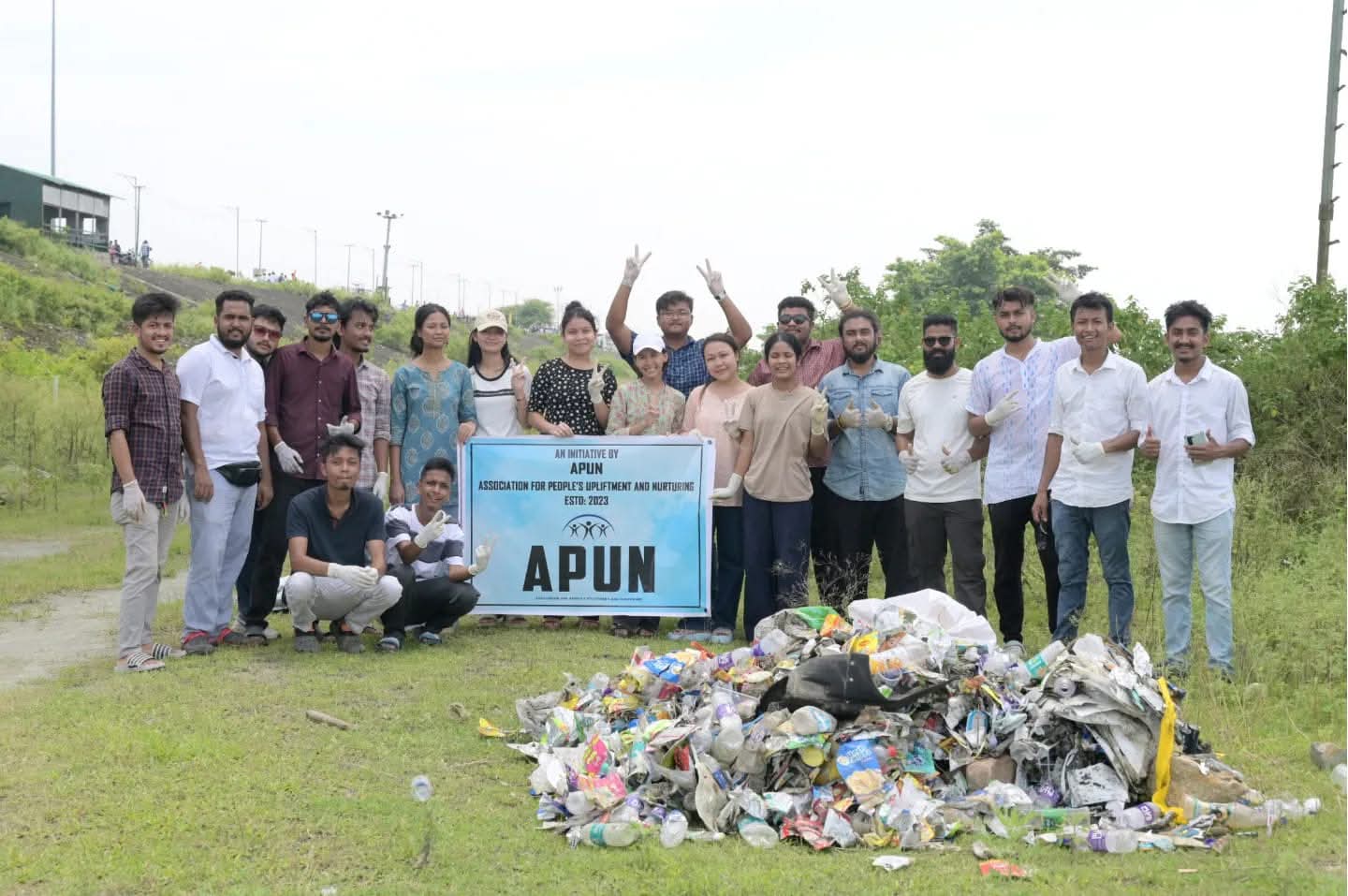 A diverse group of APUN volunteers standing together